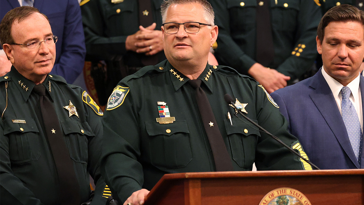Sheriff Grady Judd next to Sheriff Wayne Ivey and Governor Ron DeSantis