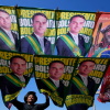 A street vendor sells campaign flags of presidential candidates Sen. Flavio Bolsonaro and incumbent President Luiz Inacio Lula da Silva, who is running for re-election in Brasilia, Brazil, Tuesday, Sept. 29, 2026.
