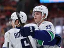 Elias Pettersson celebrates his goal against the Florida Panthers with Brock Boeser on Oct. 15, 2026 in Sunrise, Fla.
