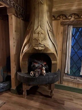 The fireplace is decorated with skulls in the Rumpelstiltskin cabin at Charmed Resorts in Crowsnest Pass.