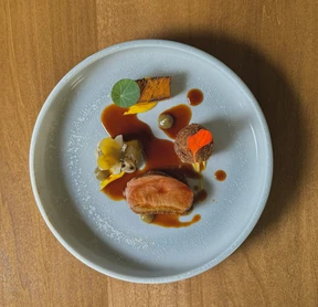 Peking duck breast from Brilliant Meadows in Mono, Ont., with duck confit croquettes, fire-roasted cabbage, miso-glazed pumpkin and smoked green tomato-jalapeno preserves at Down Home.