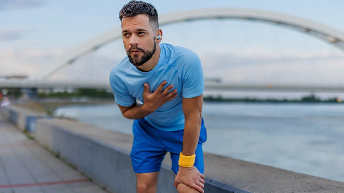 Man holding box while running.